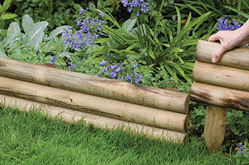 horizontal edging log border timber half round integral spikes treated pressure